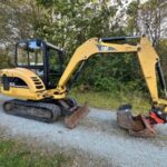 Cat 302.5C + 4 Schaufeln und hydraulisch schwenkbarer Grabenräumlöffel